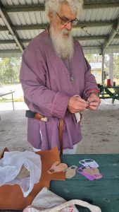 Photo showing making leather finger guards
